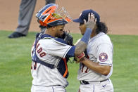 Houston Astros pitcher Luis Garcia, right, is consoled by catcher Martin Maldonado after giving up an RBI-double to Minnesota Twins' Miguel Sano in the fourth inning of a baseball game, Saturday, June 12, 2021, in Minneapolis. (AP Photo/Jim Mone)