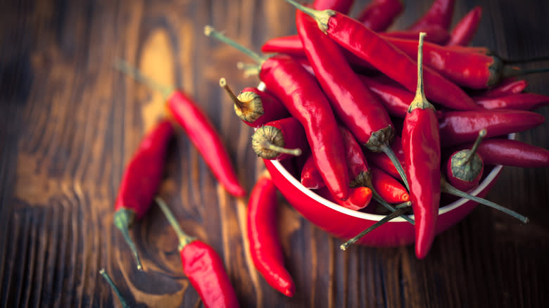 Red chili peppers on wood