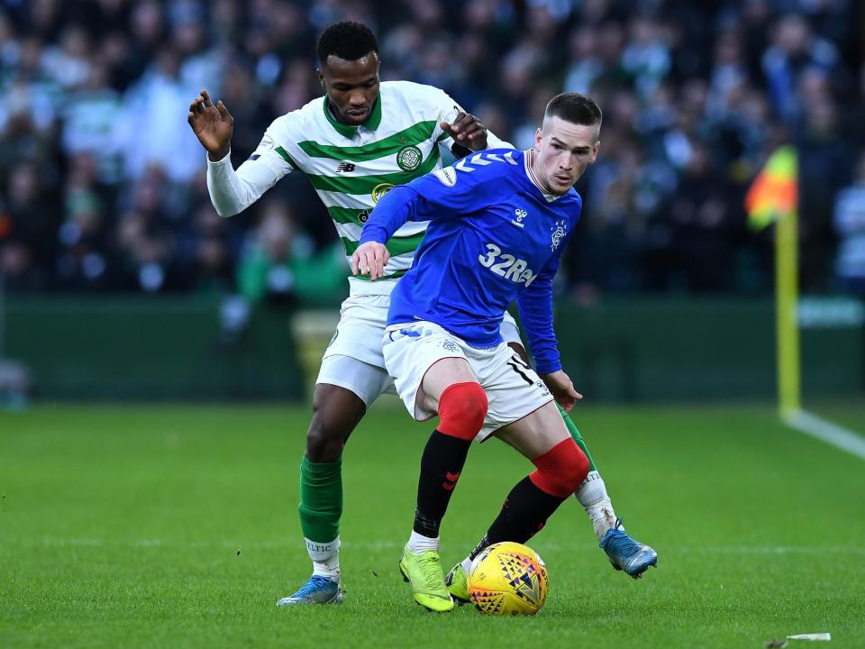 Boli Bolingoli of Celtic and Ryan Kent of Rangers: Getty Images