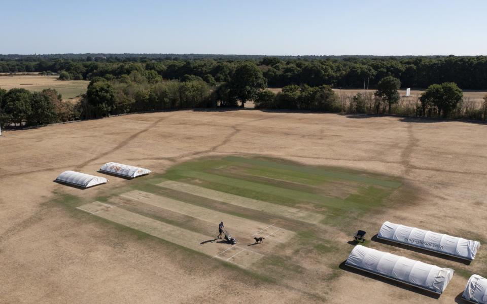 Hayes CC groundsman John Clapshoe has a tough job in difficult conditions - GETTY IMAGES