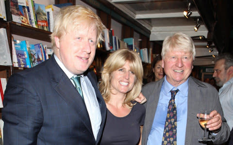 Rachel Johnson (centre) with her brother Boris and father Stanley - Credit: Getty Images 