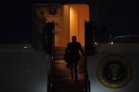 President Joe Biden walks up the steps to Air Force One as he prepares to depart Manchester-Boston Regional Airport, Tuesday, Nov. 16, 2021, in Manchester, N.H. (AP Photo/Mary Schwalm)