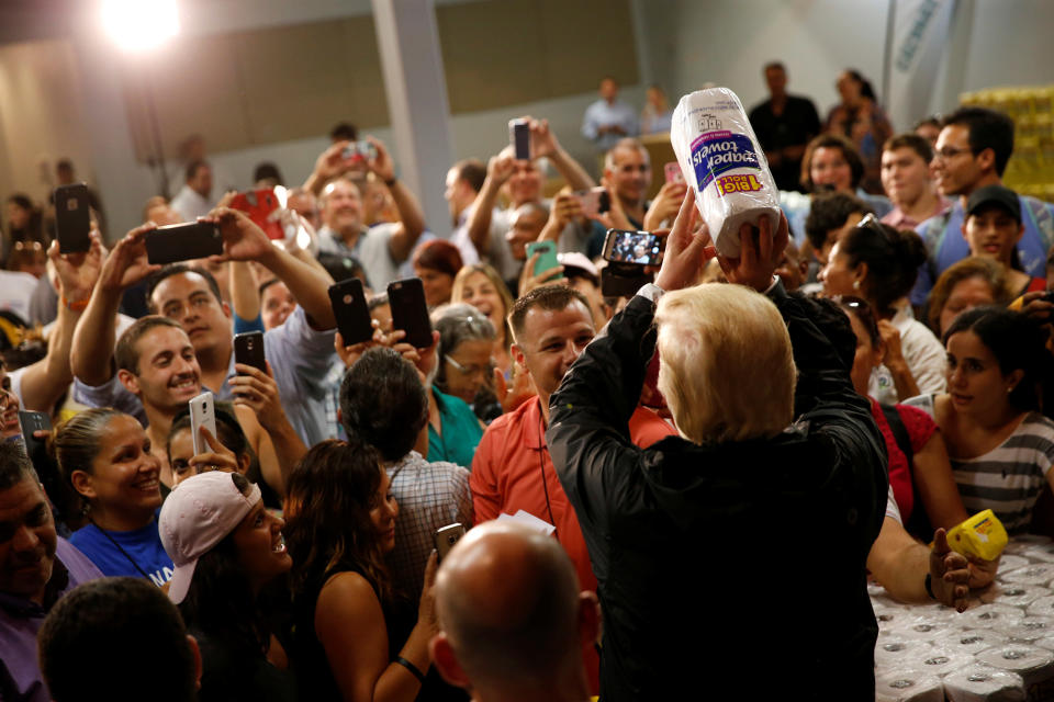 President Donald Trump faced a backlash for tossing rolls of paper towels like basketballs to people at a hurricane relief distribution center at Calvary Chapel in San Juan, Puerto Rico, last October. (Photo: Jonathan Ernst / Reuters)