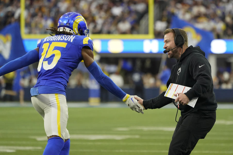 Los Angeles Rams wide receiver Demarcus Robinson (15) celebrates a touchdown with head coach Sean McVay during the second half of an NFL football game against the Washington Commanders Sunday, Dec. 17, 2023, in Inglewood, Calif. (AP Photo/Marcio Jose Sanchez)