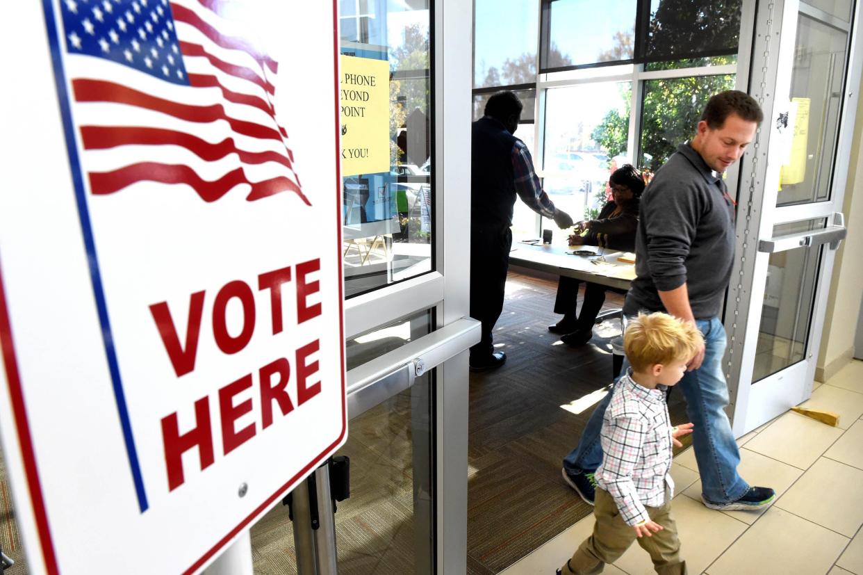 FILE: Will Cagle leaves the Augusta Municipal Building with his son, Whit, 3, after voting in a runoff election in 2018. Currently, the municipal building is the only Richmond County advance voting polling place, but two more will be opened on Wednesday, Oct. 26.