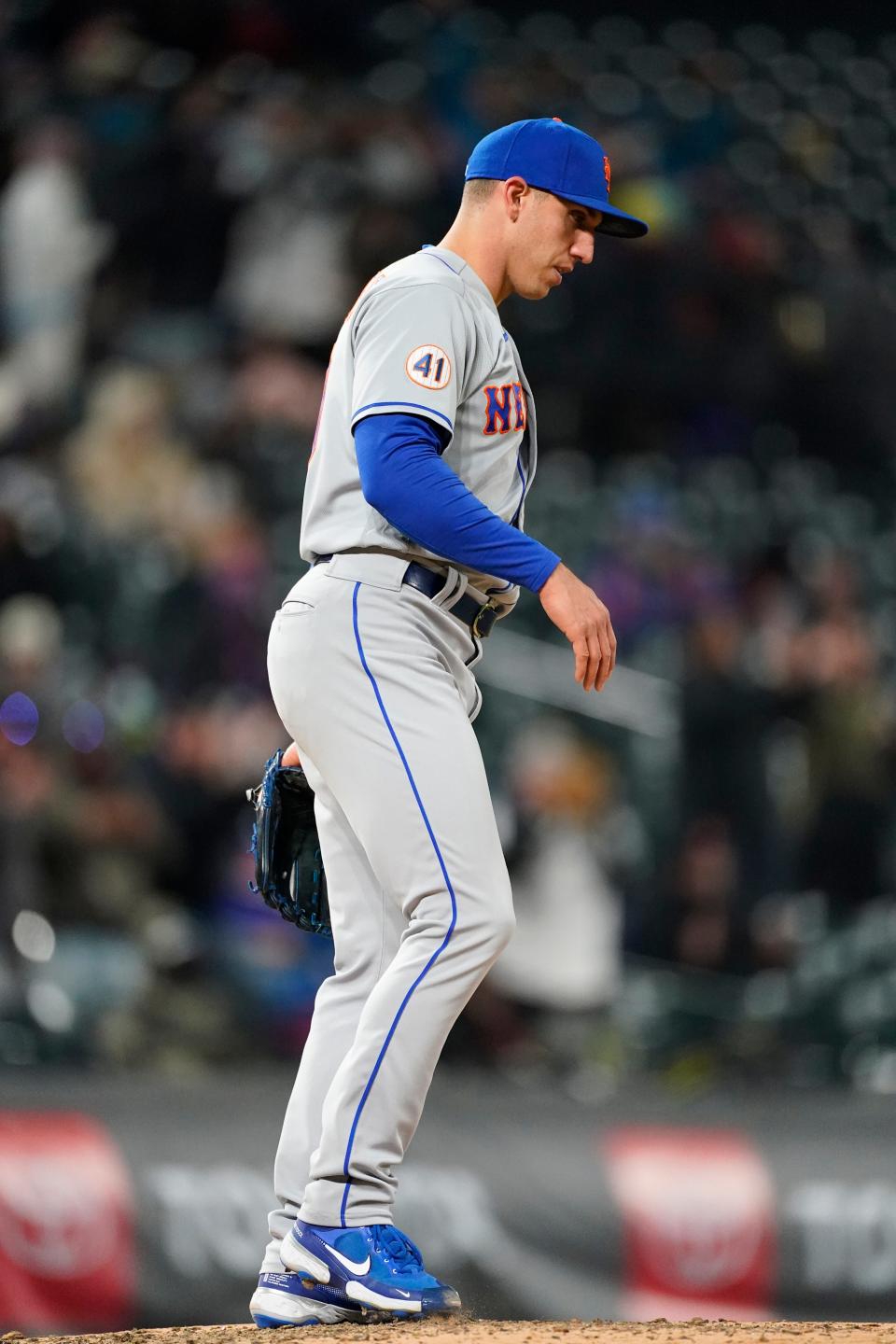 New York Mets relief pitcher Jacob Barnes reacts after giving up a three-run home run to Colorado Rockies' Josh Fuentes during the fifth inning of the second game of a baseball doubleheader Saturday, April 17, 2021, in Denver. (AP Photo/David Zalubowski)