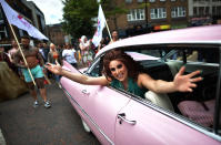 <p>Drag queen Lady Portia Di’Monte waves as she takes part in the Belfast Gay Pride march on August 5, 2017 in Belfast, Northern Ireland. (Photo: Charles McQuillan/Getty Images) </p>