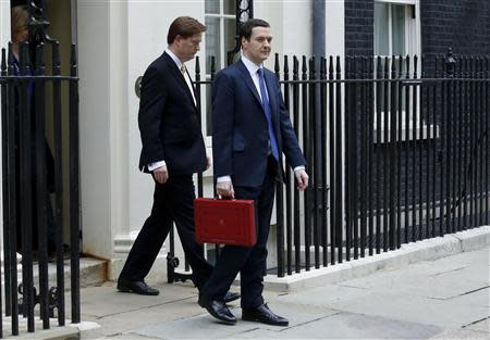 Britain's Chancellor of the Exchequer, George Osborne (R) is joined by the Chief Secretary to the Treasury Danny Alexander for a photocall outside number 11 Downing Street, before Osborne left to deliver his budget to the House of Commons, in central London March 19, 2014. REUTERS/Luke MacGregor