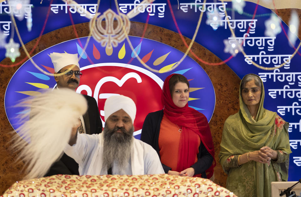 Britain's opposition Liberal Democrats party leader Jo Swinson, 2nd right, during a ceremony as she is welcomed during a visit to the Gurdwara Singh Sabha Temple for an election campaign stop in Glasgow, Scotland, Thursday Nov. 14, 2019. Britain's Brexit is one of the main issues for voters and political parties as the UK goes to the polls in a General Election on Dec. 12. (Jane Barlow/PA via AP)