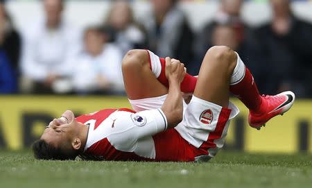 Britain Football Soccer - Tottenham Hotspur v Arsenal - Premier League - White Hart Lane - 30/4/17 Arsenal's Alexis Sanchez sustains an injury Action Images via Reuters / Paul Childs Livepic