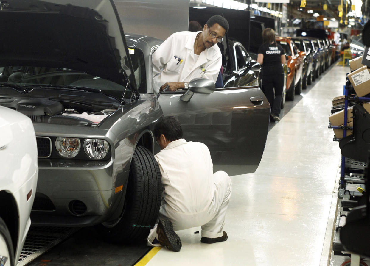 Chrysler Group LLC employees work on the assembly line during the production launch of Chrysler vehicles at the assembly plant in Brampton (REUTERS)