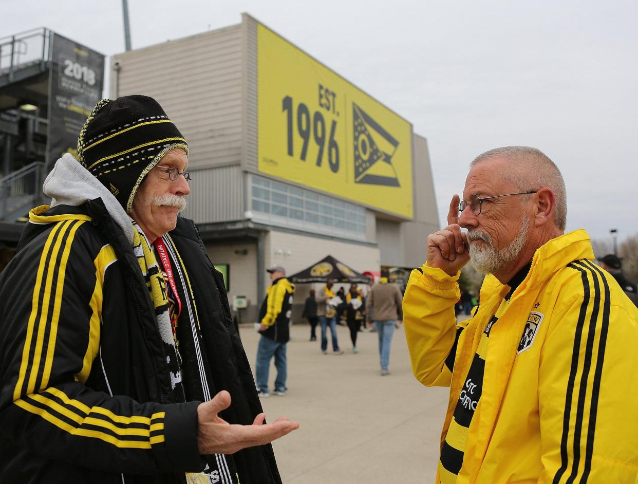 Randy Sims of Charleston, West Virginia, at right and speaking to Centerville's Stan Jenkins, was such a devout Crew fan, he was once asked to address the team.