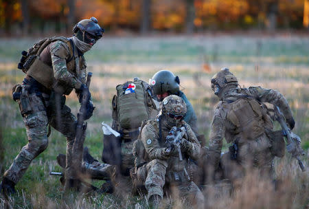 Belgian army Special Forces are seen during the Black Blade military exercise involving several European Union countries and organised by the European Defence Agency at Florennes airbase, Belgium November 30, 2016. REUTERS/Yves Herman