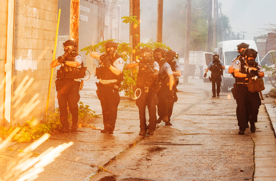 Police officers deploy to disperse crowds gathered to protest the death of George Floyd in Minneapolis on May 26. | Richard Tsong-Taatarii—Star Tribune/AP