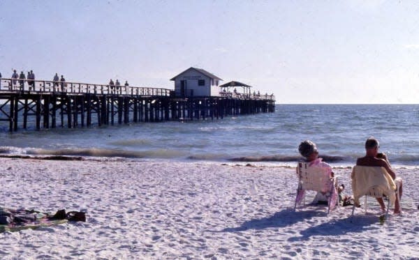 Beachgoers near the pier at Fort Myers Beach (1969 circa).