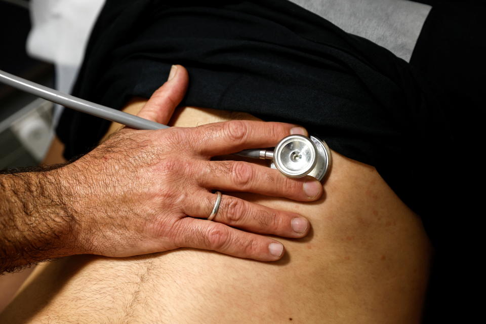 A patient suffering from Long COVID is examined in the post-coronavirus disease (COVID-19) clinic of Ichilov Hospital in Tel Aviv, Israel, February 21, 2022. Picture taken February 21, 2022. REUTERS/Amir Cohen