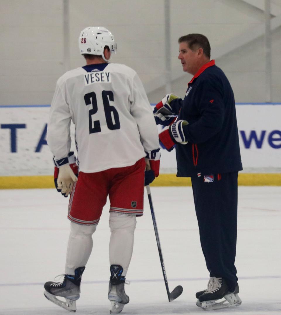 New York Rangers head coach Peter Laviolette, right, chats with Jimmy Vesey during a training session at their facility in Tarrytown, Sept. 22, 2023.