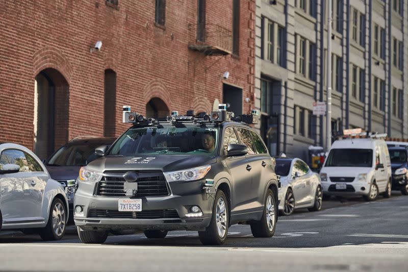 Vehicle belonging to California-based self-driving startup Zoox Inc is seen driving along a street