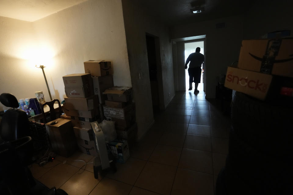 Freddie Davis prepares for an eviction that he knows could be coming at any time, Thursday, Sept. 2, 2021, at his one-bedroom apartment in Miami. Soon after losing his trucking job amid the pandemic, Davis was told his landlord was almost doubling the rent on his Miami apartment. (AP Photo/Rebecca Blackwell)