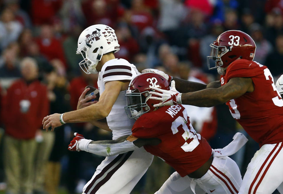 Mississippi State quarterback Nick Fitzgerald (7) is sacked by Alabama linebacker Dylan Moses (32) and linebacker Anfernee Jennings (33) during the second half of an NCAA college football game, Saturday, Nov. 10, 2018, in Tuscaloosa, Ala. Alabama won 24-0. (AP Photo/Butch Dill)