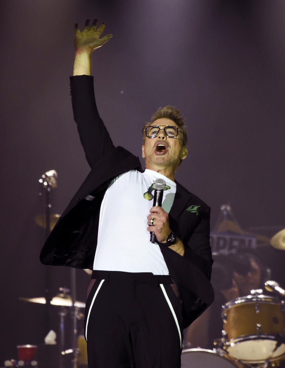 Actor Robert Downey Jr. addresses the crowd before the Rolling Stones concert at the Rose Bowl, Thursday, Aug. 22, 2019, in Pasadena, Calif. Downey announced that NASA has officially named a rock spotted rolling across the surface of Mars by its InSight lander "Rolling Stones Rock." (Photo by Chris Pizzello/Invision/AP)