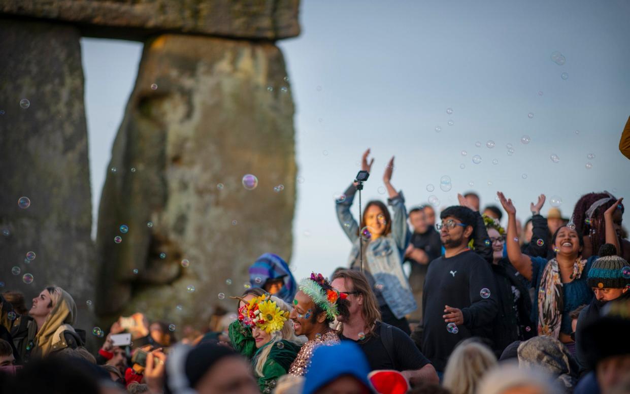 Revellers at the Summer Solstice Sunrise at Stonehenge, earlier today - Geoff Pugh