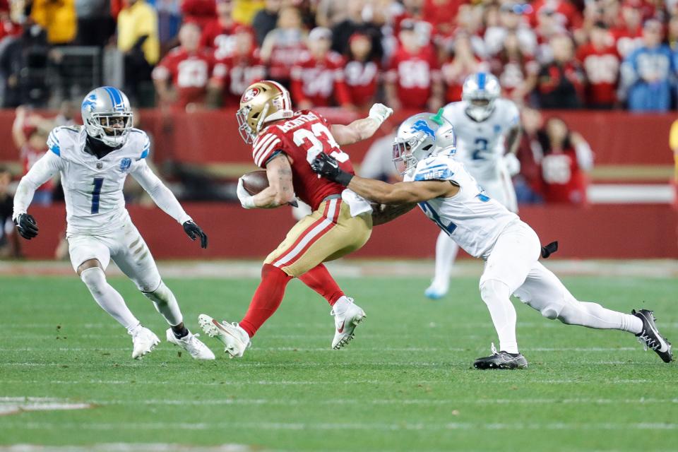 Lions safety Brian Branch tackles 49ers running back Christian McCaffrey during the second half of the Lions' 34-31 loss in the NFC championship game in Santa Clara, California, on Sunday, Jan. 28, 2024.