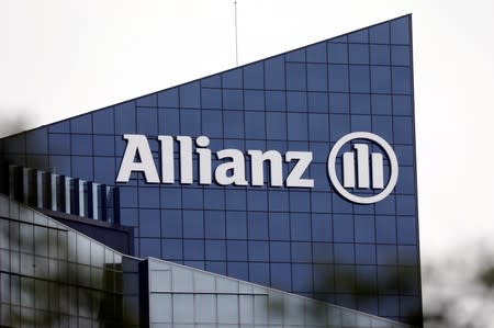 FILE PHOTO: The logo of insurer Allianz SE is seen on the company building in Puteaux at the financial and business district of La Defense near Paris