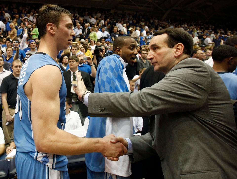 Duke coach Mike Krzyzewski congratulates North Carolina's Tyler Hansbrough following an NCAA college basketball game in Durham, N.C., Wednesday, Feb. 11, 2009. North Carolina won 101-87.