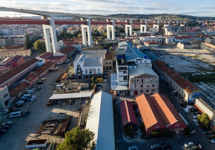 <span class="caption">Lisbon’s LX Factory.</span> <span class="attribution"><a class="link " href="https://www.flickr.com/photos/30478819@N08/33547758052/sizes/l/" rel="nofollow noopener" target="_blank" data-ylk="slk:wuestenigel/Flickr.;elm:context_link;itc:0;sec:content-canvas">wuestenigel/Flickr.</a>, <a class="link " href="http://creativecommons.org/licenses/by/4.0/" rel="nofollow noopener" target="_blank" data-ylk="slk:CC BY;elm:context_link;itc:0;sec:content-canvas">CC BY</a></span>