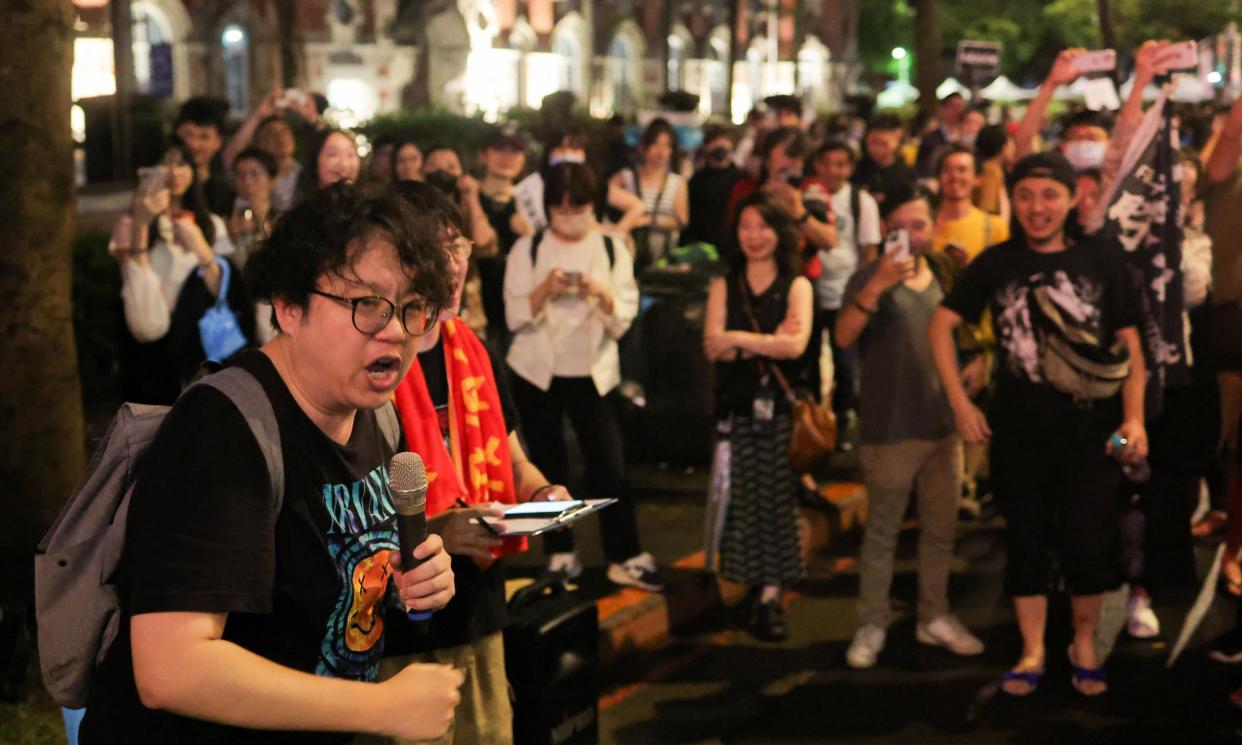 <span>People protest outside the parliament in Taipei.</span><span>Photograph: Ann Wang/Reuters</span>