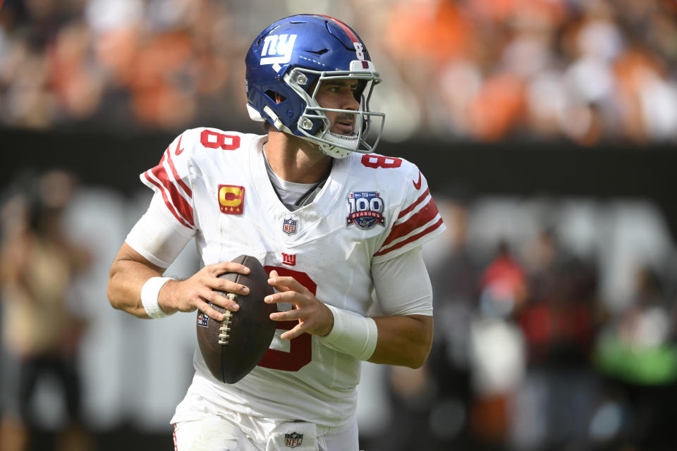 New York Giants quarterback Daniel Jones rolls out to pass against the Cleveland Browns during the second half of an NFL football game, Sunday, Sept. 22, 2024, in Cleveland. (AP Photo/David Richard)