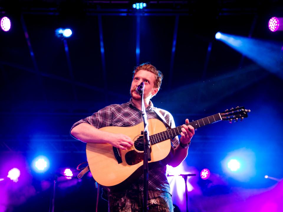 Tyler Childers performs on the Cripple Creek Stage during the Rhythm N' Blooms Festival held in Knoxville's Old City on Friday, May 17, 2019.