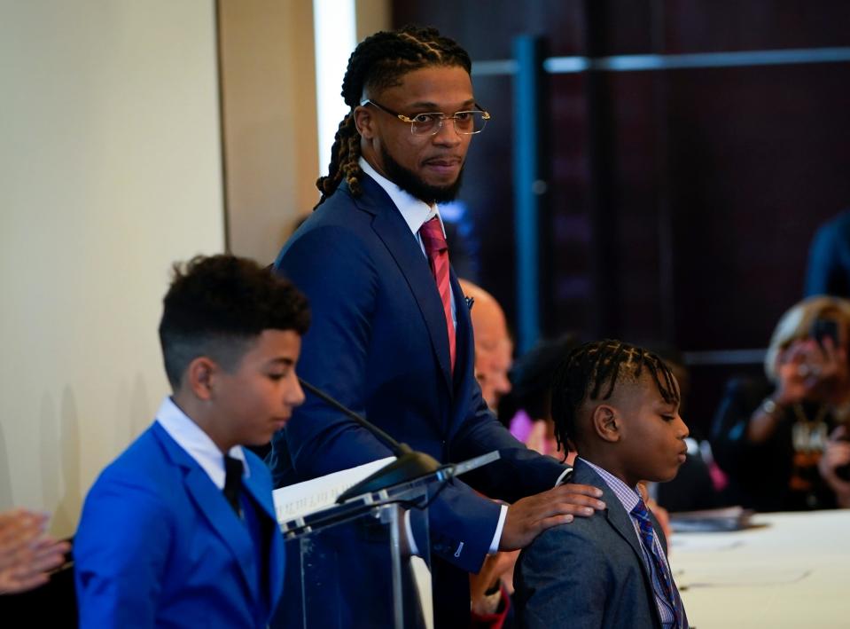 Buffalo Bills Damar Hamlin, center, at an event with Rep. Sheila Cherfilus-McCormick, D-Fla., in Washington, D.C. on March 29, 2023. Following Hamlin's collapse on the playing field and the death of Northern Kentucky soccer player Matthew Mangine, Jr.,Cherfilus-McCormick began drafting legislation to help provide money to schools for AEDs.