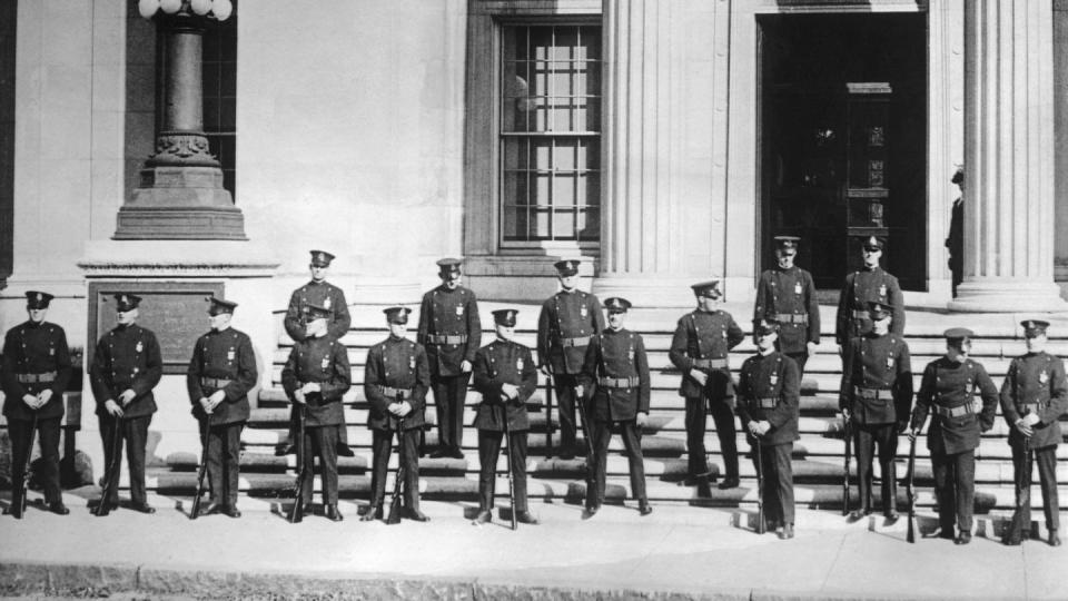policemen guarding a courthouse