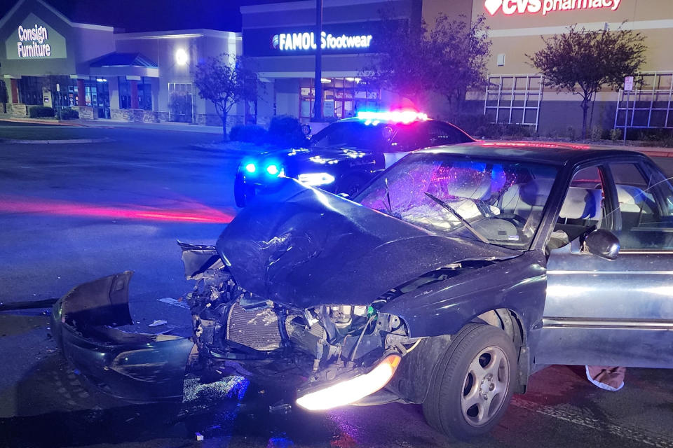 A crashed vehicle is seen in Reno, Nev., early Saturday, Oct. 1, 2022. Hundreds of cars took over northern Nevada parking lots and intersections Friday night Sept. 30, and into Saturday, Oct. 1, 2022, performing stunts in souped-up vehicles and leading to crashes and arrests, police said. Police beefed up nighttime staffing after social media posts urged people from San Francisco and Portland, Oregon, to come to the "sideshow" in Reno, Police Lt. Michael Browett said. (Lt. Michael Browett/Reno Police Department via AP)