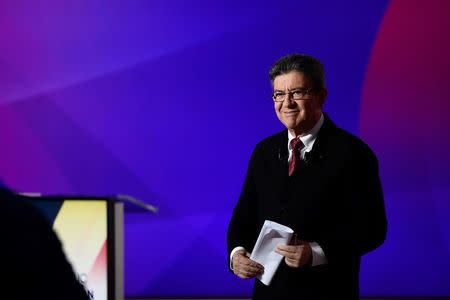 Jean-Luc Melenchon of the French far left Parti de Gauche and candidate for the 2017 French presidential election, arrives on the set at the studios of France 2 television station during the special prime time political show, "15min to Convince" in Saint-Cloud, near Paris, France, April 20, 2017. REUTERS/Martin Bureau/Pool