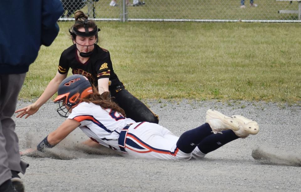 Advanced Math & Science base runner Sophia Hammel is tagged out at second base by Case shortstop Lily Picard in the second inning.