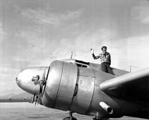 Amelia Earhart waves from the Electra before taking off from Los Angeles, Ca., on March 10, 1937.