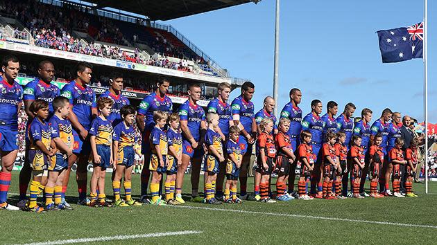 Newcastle Knights players show respect.