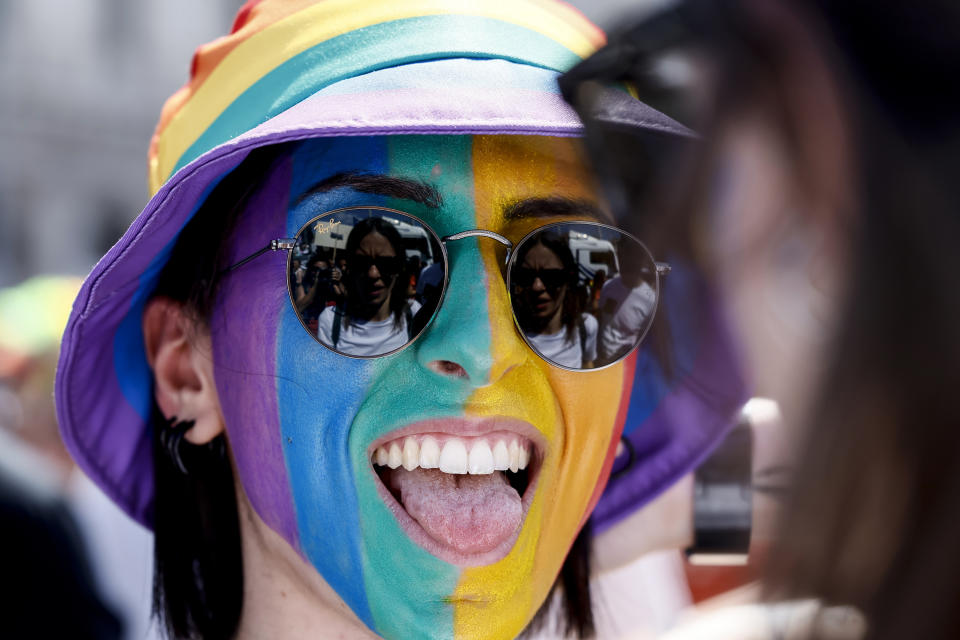 A participant in the LGBTQ+ Pride parade in Rome, Saturday, June 10, 2023. Rome’s annual LGBTQ+ Pride parade was winding its way through the Italian capital on Saturday, providing a colorful counterpoint to the right-wing national government’s crackdown on surrogate pregnancies. Some three dozen floats joined the event, including one celebrating what LGBTQ+ activists dub the “rainbow families” of same-sex couples with children. (Cecilia Fabiano/LaPresse via AP)