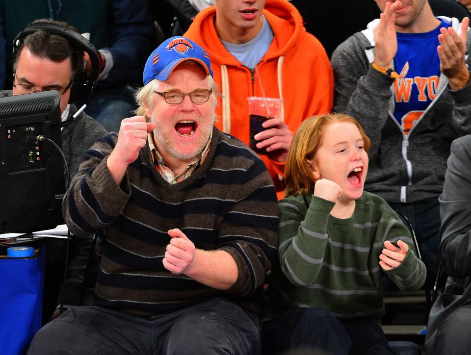 Philip Seymour Hoffman and Cooper Hoffman attend a Knicks game in January 2013. (James Devaney via Getty Images)