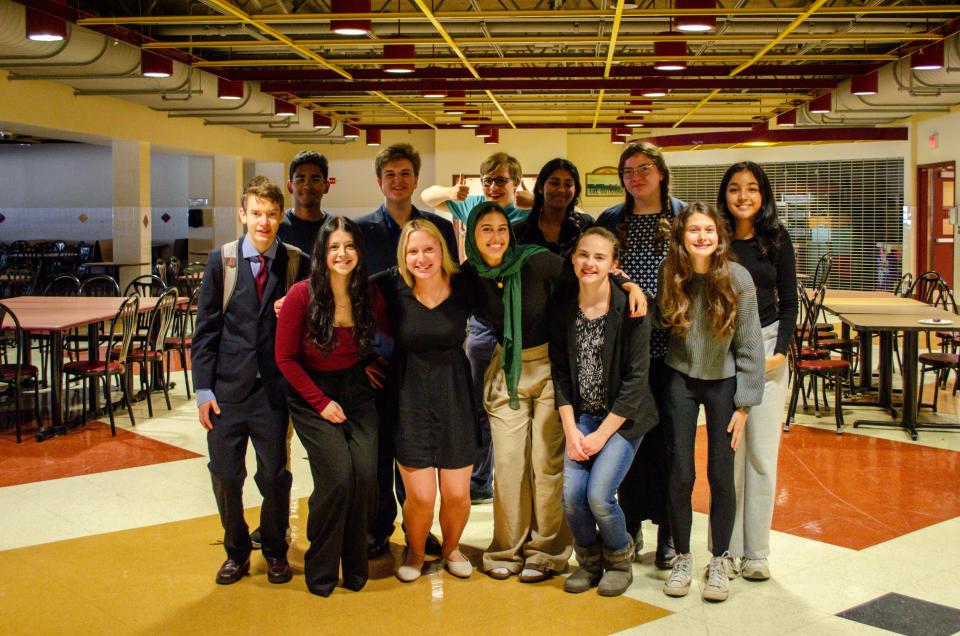 Portsmouth High School debate team members, in front, from left, are Charlie Anderson, Hailey Venuto, Anya Bake, Mariam Nada, Lexi Lambert and Addyson Demers. In back are Marlon Pinto, Owen Coffey, Charlie Honeyman, Rithika Rajavel, Nina Cummins and Vritti Mehra. The team hosted a competition Sept. 30, 2023.