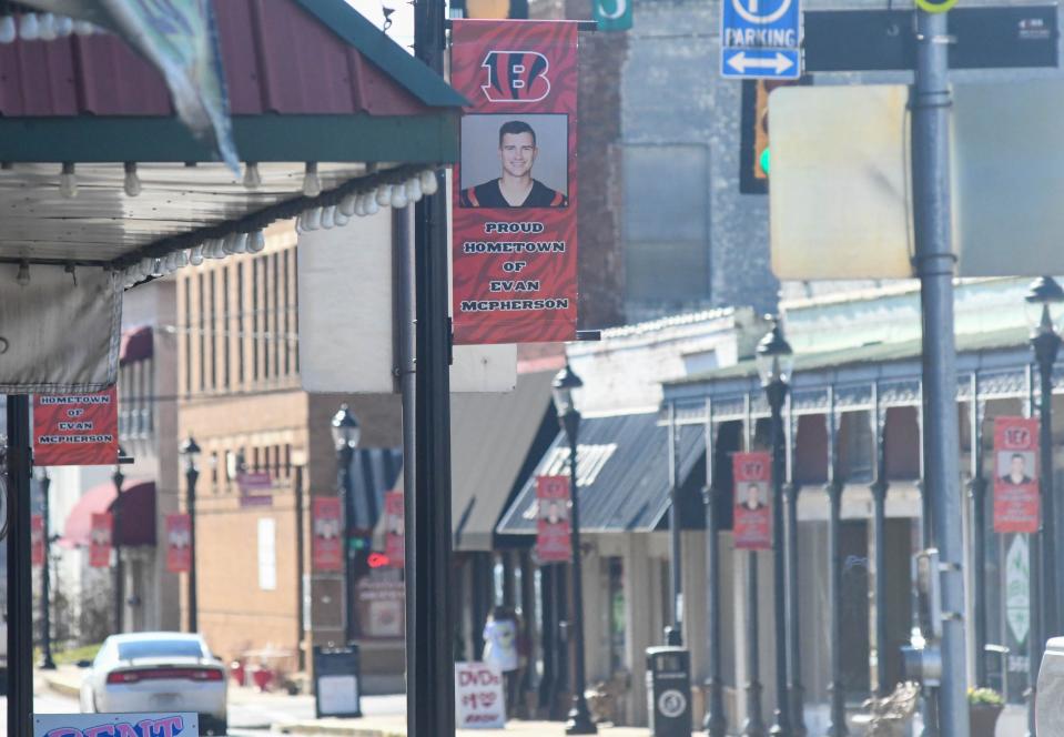 Signs that read "Proud hometown of Evan McPherson" flood the streets of downtown Fort Payne to celebrate McPherson's trip to the Super Bowl.