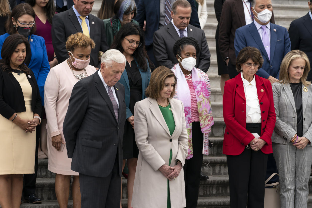 Majority Leader Steny Hoyer, House Speaker Nancy Pelosi and other members of the House on the steps of the Capitol.