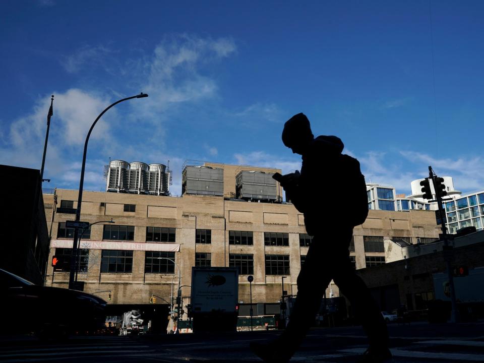 A person walks by an old terminal building in New York City