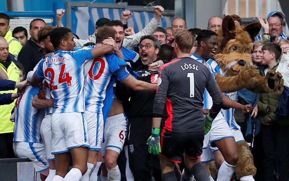 David Wagner celebrates with his Huddersfield players after a goal against Watford in April 2018