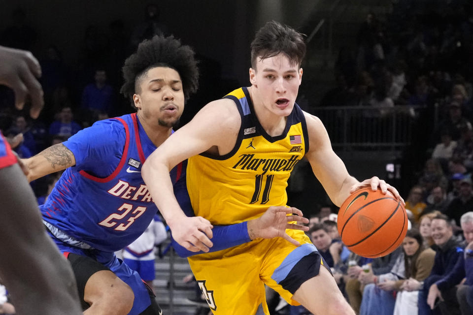 FILE - Marquette's Tyler Kolek (11) drives to the basket as DePaul's Caleb Murphy defends during the first half of an NCAA college basketball game, Saturday, Jan. 28, 2023, in Chicago. Kolek is the Associated Press' Big East player of the year in voting released Tuesday, March 7, 2023. (AP Photo/Charles Rex Arbogast, File)