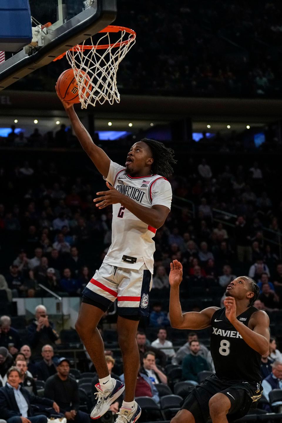 Connecticut Huskies guard Tristen Newton (2) breaks away for a layup in the second half of the NCAA Big East Conference Tournament second round game between the Connecticut Huskies and the Xavier Musketeers at Madison Square Garden in New York City on Thursday, March 14, 2024. Xavier was eliminated from the tournament by a 87-60 loss to UConn.