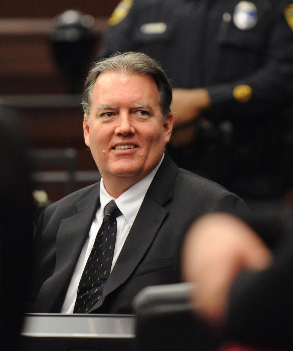 Michael Dunn smiles at his parents during a break in his trial in Jacksonville, Fla. Wednesday, Feb. 12, 2014. Dunn is charged in the shooting death of Jordan Davis in November 2012. (The Florida Times-Union, Bob Mack, Pool)